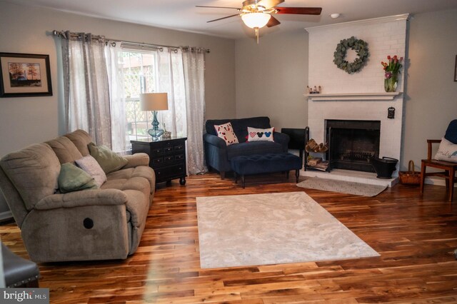 9348 Amaryllis Ave, Manassas, VA 20110 - living room featuring a ceiling fan, a fireplace, and wood finished floors