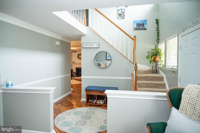 9348 Amaryllis Ave, Manassas, VA 20110 - stairway with wood finished floors, crown molding, baseboards, and a fireplace