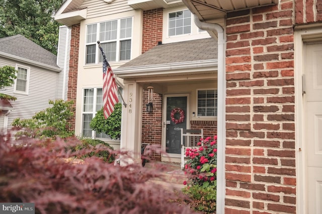 9348 Amaryllis Ave, Manassas, VA 20110 - entrance to property featuring brick siding and a shingled roof