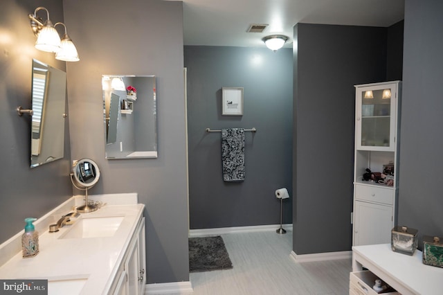 9348 Amaryllis Ave, Manassas, VA 20110 - full bathroom with double vanity and baseboards