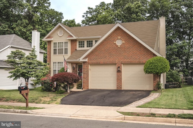 9348 Amaryllis Ave, Manassas, VA 20110 - traditional-style home featuring brick siding, asphalt driveway, a garage, a chimney, and a front yard