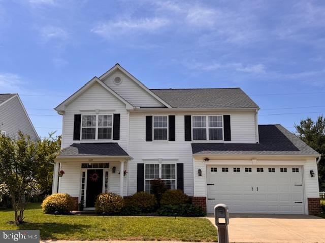 1110 Osprey Ln, Denton, MD 21629 - view of front of house with concrete driveway and a front yard