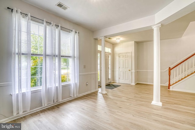1110 Osprey Ln, Denton, MD 21629 - entrance foyer with ornate columns, wood finished floors, and healthy amount of natural light