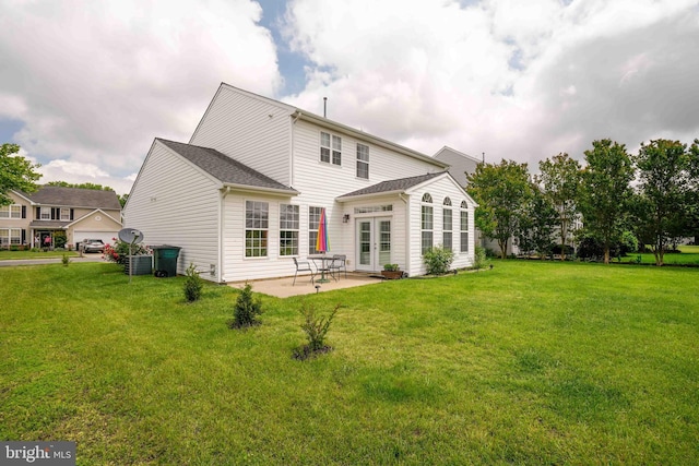1110 Osprey Ln, Denton, MD 21629 - back of property featuring a lawn, a patio area, and french doors
