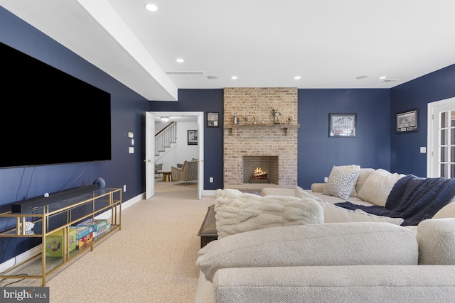 7 Chaville Way, Greenville, DE 19807 - carpeted living room with stairs, baseboards, a fireplace, and recessed lighting