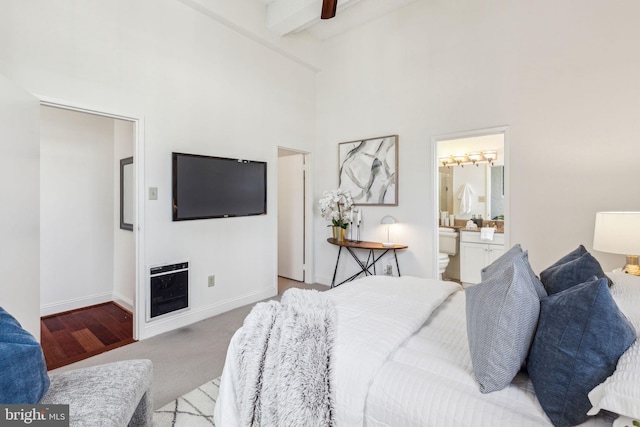 2429 Locust St Unit 504, Philadelphia, PA 19103 - bedroom with beam ceiling, a towering ceiling, baseboards, ensuite bathroom, and carpet floors