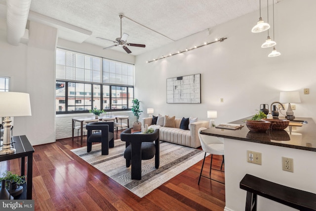 2429 Locust St Unit 504, Philadelphia, PA 19103 - living room with a ceiling fan, rail lighting, a textured ceiling, and wood finished floors
