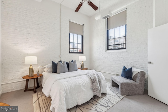 2429 Locust St Unit 504, Philadelphia, PA 19103 - bedroom with multiple windows, carpet, a ceiling fan, and brick wall