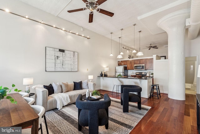 2429 Locust St Unit 504, Philadelphia, PA 19103 - living room featuring ceiling fan, dark wood finished floors, ornate columns, track lighting, and baseboards