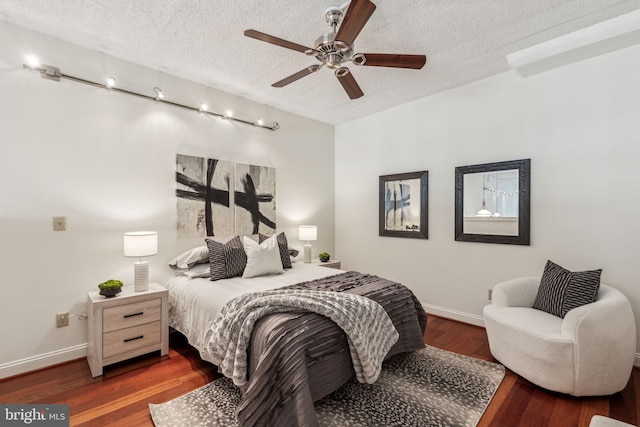 2429 Locust St Unit 504, Philadelphia, PA 19103 - bedroom with wood finished floors, baseboards, a textured ceiling, and ceiling fan