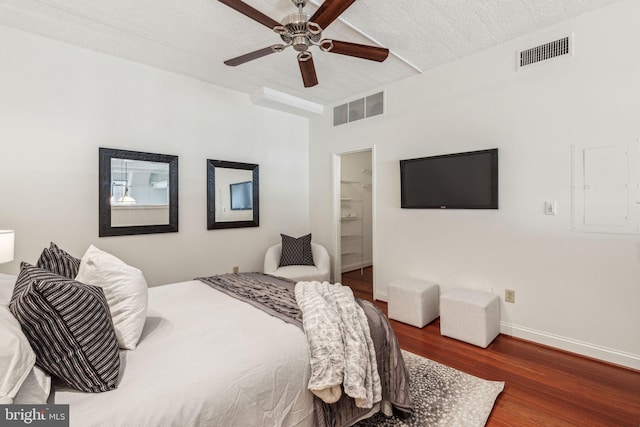 2429 Locust St Unit 504, Philadelphia, PA 19103 - bedroom with wood finished floors, baseboards, electric panel, a textured ceiling, and ceiling fan