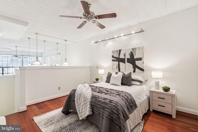2429 Locust St Unit 504, Philadelphia, PA 19103 - bedroom with a textured ceiling, wood finished floors, baseboards, and a ceiling fan