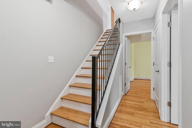 3318 Sherman Ave NW Unit 104, Washington, DC 20010 - stairway featuring wood finished floors and baseboards