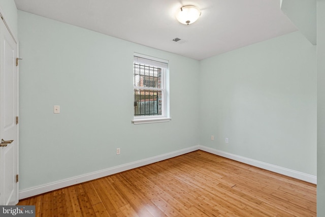 3318 Sherman Ave NW Unit 104, Washington, DC 20010 - empty room with hardwood / wood-style flooring and baseboards