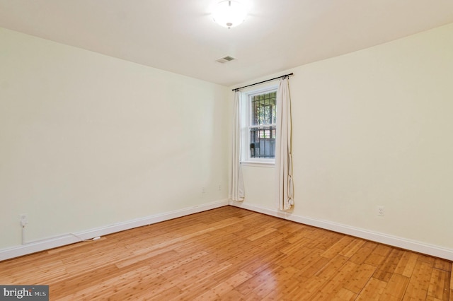 3318 Sherman Ave NW Unit 104, Washington, DC 20010 - empty room featuring light wood-style flooring and baseboards
