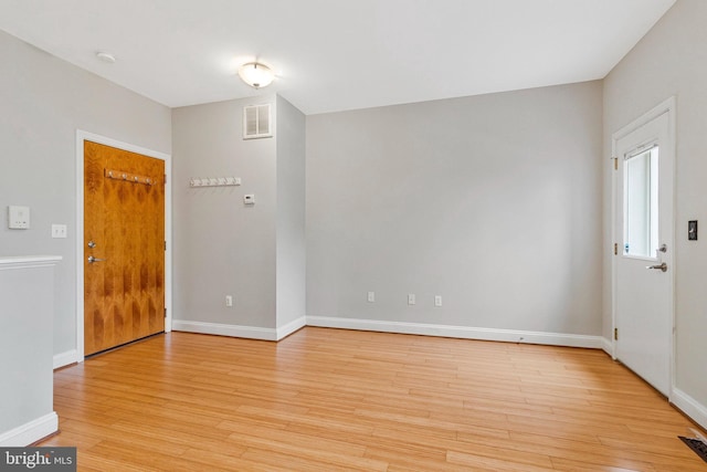 3318 Sherman Ave NW Unit 104, Washington, DC 20010 - empty room with light wood-style flooring, baseboards, and a smoke detector