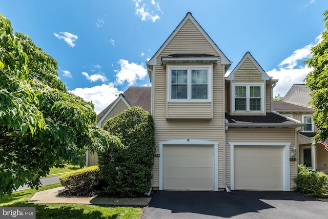 534 Country Club Dr, Lansdale, PA 19446 - townhome / multi-family property with asphalt driveway, a garage, and roof with shingles