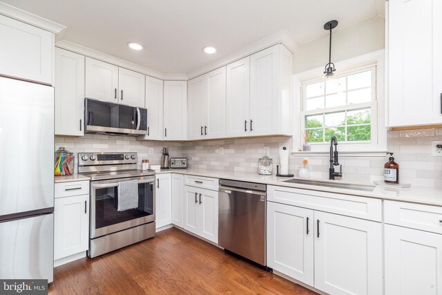 534 Country Club Dr, Lansdale, PA 19446 - kitchen featuring appliances with stainless steel finishes, a sink, light countertops, white cabinets, and recessed lighting
