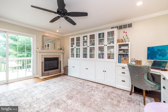 534 Country Club Dr, Lansdale, PA 19446 - office area with wood finished floors, crown molding, a tile fireplace, ceiling fan, and recessed lighting
