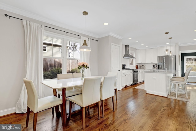 11214 Midvale Rd, Kensington, MD 20895 - dining room with crown molding, wood finished floors, recessed lighting, and baseboards