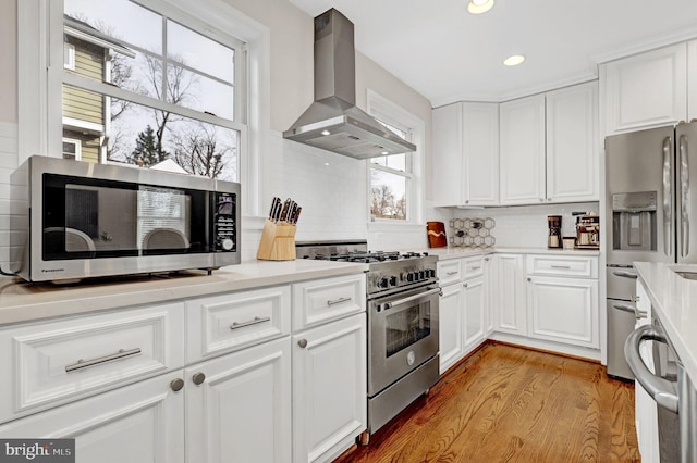 11214 Midvale Rd, Kensington, MD 20895 - kitchen with range hood, appliances with stainless steel finishes, healthy amount of natural light, white cabinetry, and recessed lighting