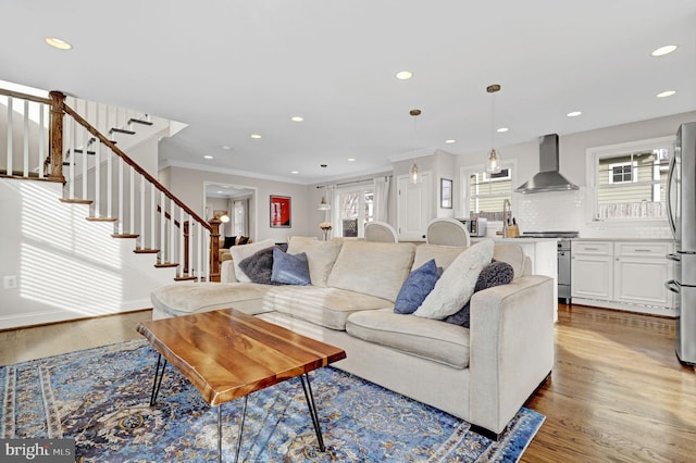 11214 Midvale Rd, Kensington, MD 20895 - living area with wood finished floors, stairway, recessed lighting, ornamental molding, and baseboards