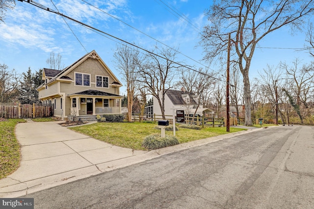 11214 Midvale Rd, Kensington, MD 20895 - view of front of property with covered porch, concrete driveway, and a shingled roof