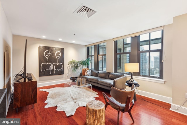 1500 Chestnut St Unit 20K, Philadelphia, PA 19102 - living room featuring baseboards, plenty of natural light, wood finished floors, and recessed lighting