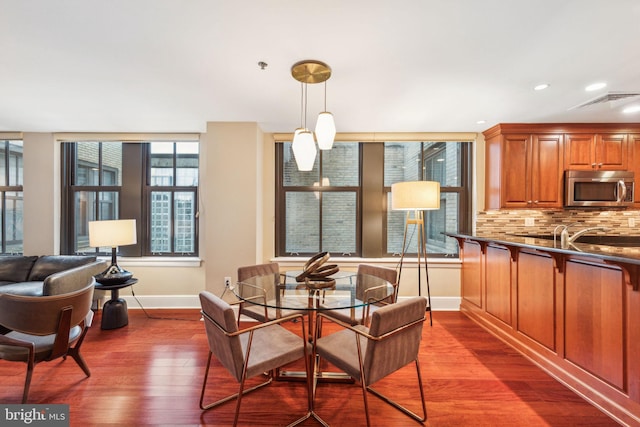 1500 Chestnut St Unit 20K, Philadelphia, PA 19102 - dining space with baseboards, dark wood-style floors, and recessed lighting