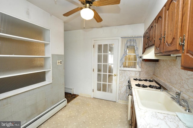 19 Rose Ave, Maple Shade, NJ 08052 - kitchen featuring a baseboard radiator, brown cabinets, light countertops, and a sink