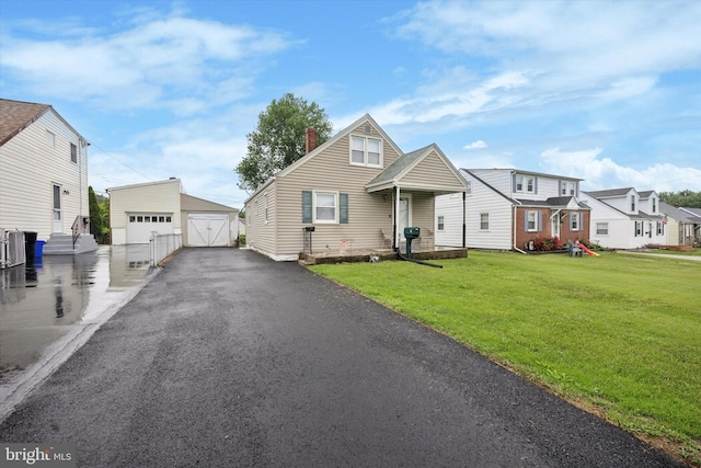 7 Neeld Ln, Aston, PA 19014 - view of front facade with a garage, a front yard, an outdoor structure, and a chimney