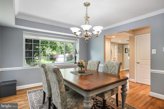 13704 Beret Pl, Silver Spring, MD 20906 - dining room with a chandelier, ornamental molding, light wood-type flooring, and baseboards