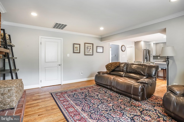 13704 Beret Pl, Silver Spring, MD 20906 - living room featuring light wood-style floors, crown molding, recessed lighting, and baseboards