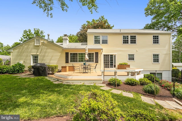 13704 Beret Pl, Silver Spring, MD 20906 - rear view of property featuring a deck, a chimney, and outdoor dining space