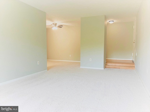 8015 Mandan Rd Unit 203, Greenbelt, MD 20770 - empty room featuring a ceiling fan, light carpet, and baseboards