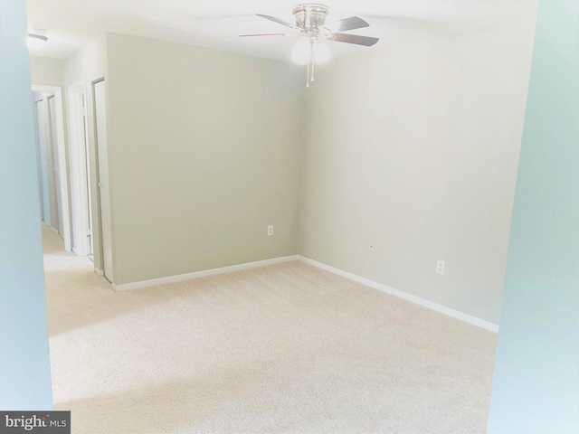8015 Mandan Rd Unit 203, Greenbelt, MD 20770 - empty room with light colored carpet, ceiling fan, and baseboards