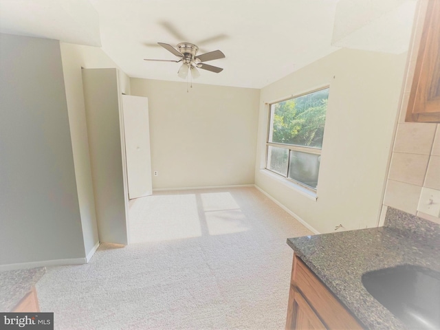 8015 Mandan Rd Unit 203, Greenbelt, MD 20770 - interior space featuring a ceiling fan, a sink, light colored carpet, and baseboards