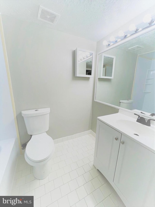 8015 Mandan Rd Unit 203, Greenbelt, MD 20770 - full bath with toilet, vanity, a textured ceiling, and tile patterned flooring