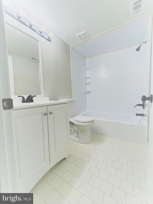 8015 Mandan Rd Unit 203, Greenbelt, MD 20770 - full bathroom featuring a textured ceiling, toilet, vanity, bathtub / shower combination, and tile patterned floors