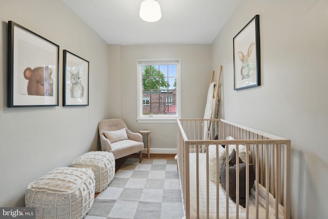 711 Avon Pl, Alexandria, VA 22314 - bedroom featuring light wood-style flooring and baseboards
