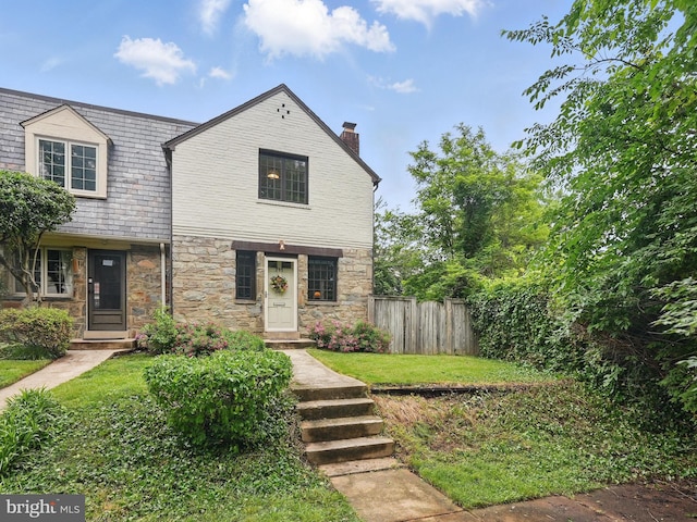 711 Avon Pl, Alexandria, VA 22314 - view of front of house with stone siding, a high end roof, and a chimney