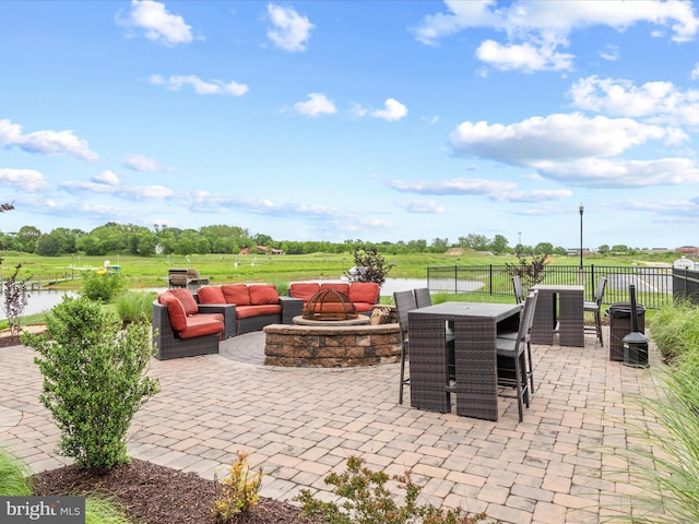 24258 Zinfandel Ln Unit R303, Lewes, DE 19958 - view of patio / terrace featuring a water view and an outdoor living space with a fire pit