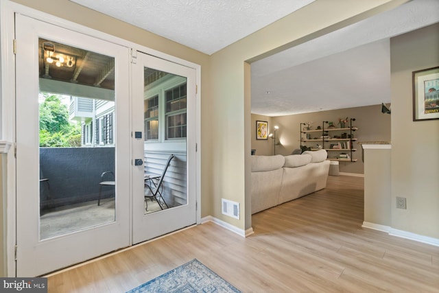 1328 Greenbriar Cir Unit 5-1328, Baltimore, MD 21208 - doorway with wood finished floors and baseboards