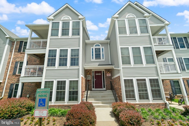 1328 Greenbriar Cir Unit 5-1328, Baltimore, MD 21208 - view of property featuring brick siding