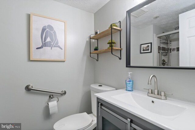 1328 Greenbriar Cir Unit 5-1328, Baltimore, MD 21208 - full bath with a textured ceiling, toilet, a shower stall, and vanity