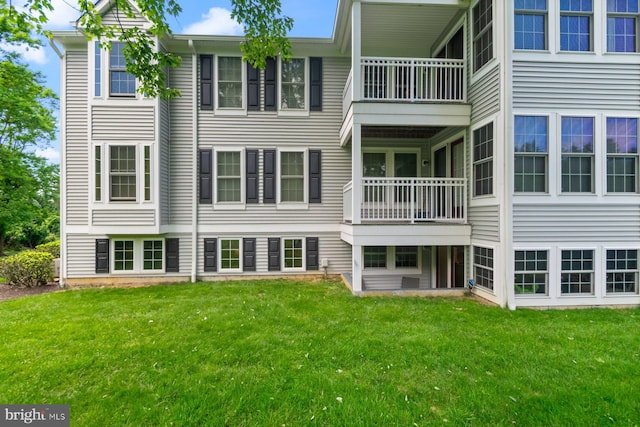 1328 Greenbriar Cir Unit 5-1328, Baltimore, MD 21208 - rear view of property with a balcony and a lawn