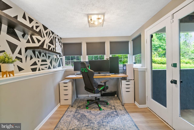 1328 Greenbriar Cir Unit 5-1328, Baltimore, MD 21208 - office area with plenty of natural light, wood finished floors, french doors, and a textured ceiling