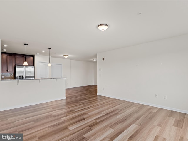 24238 Zinfandel Ln Unit R307, Lewes, DE 19958 - unfurnished living room featuring recessed lighting, light wood-style flooring, and baseboards