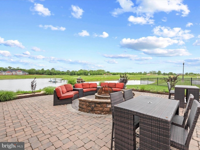 24238 Zinfandel Ln Unit R307, Lewes, DE 19958 - view of patio / terrace featuring a water view, an outdoor living space with a fire pit, and outdoor dining space