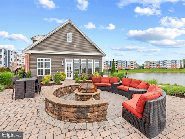 24238 Zinfandel Ln Unit R307, Lewes, DE 19958 - view of patio / terrace featuring an outdoor living space with a fire pit and a water view